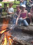 Girl toasting marshmallow over a fire