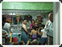 Children and adults in a popsicle store