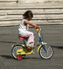 Girl on a yellow bike
