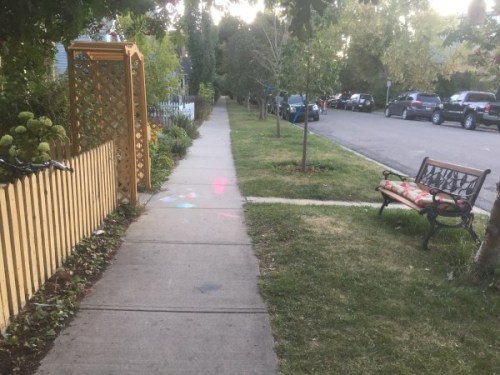 Front yard and bench with sidewalk chalk, Sunnyside, Calgary