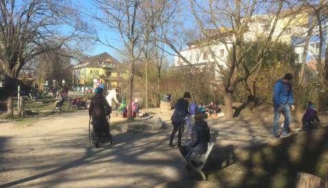 Families enjoying a green space in Vauban, Freiburg, March 2018